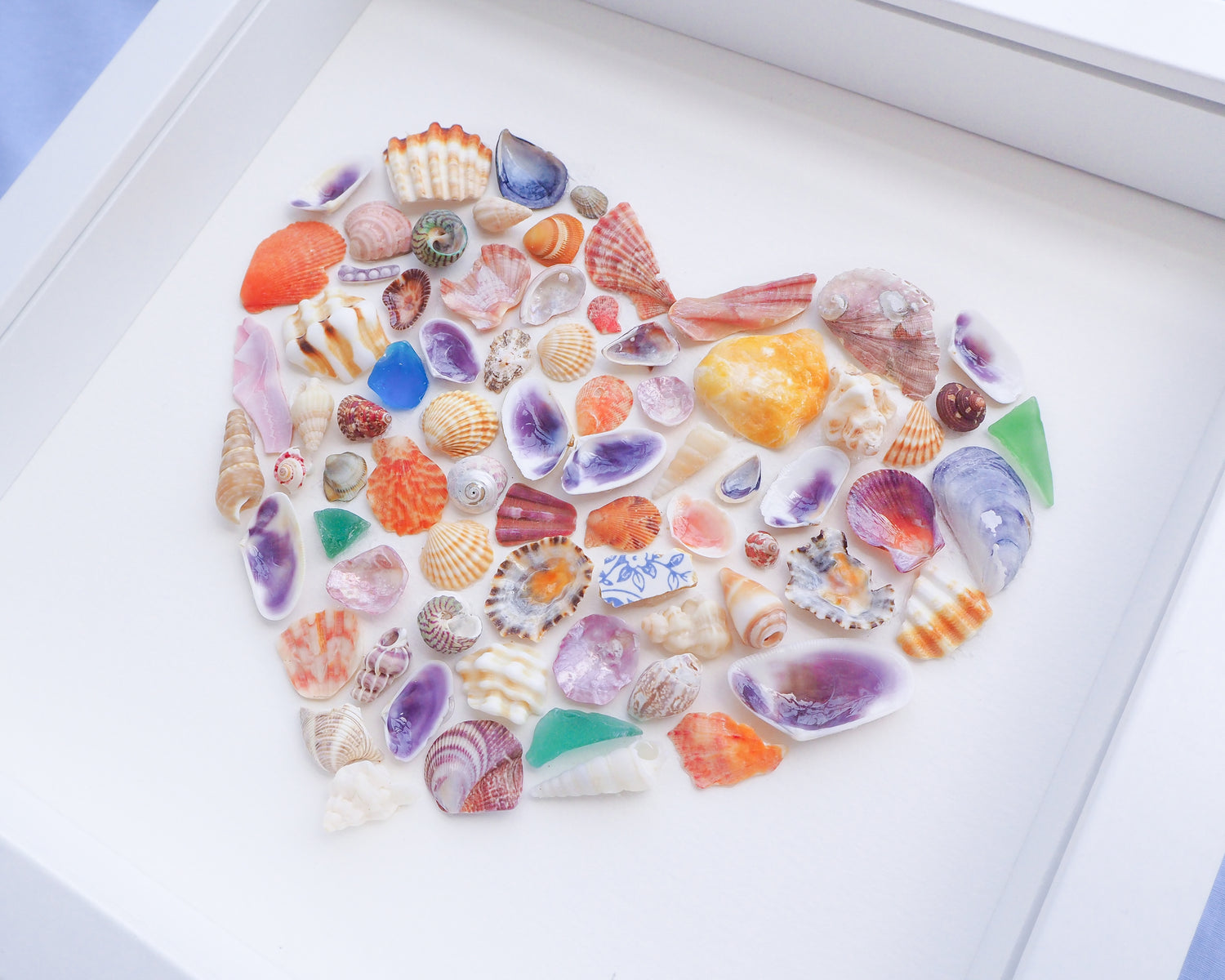 Side view of Rainbow Seashell Heart Artwork with colorful shell handpicked from Portugal. Coastal Home Wall Decor, Shell Wall Art, Handmade Shell Artwork, Cute Coastal Nursery Decoration 