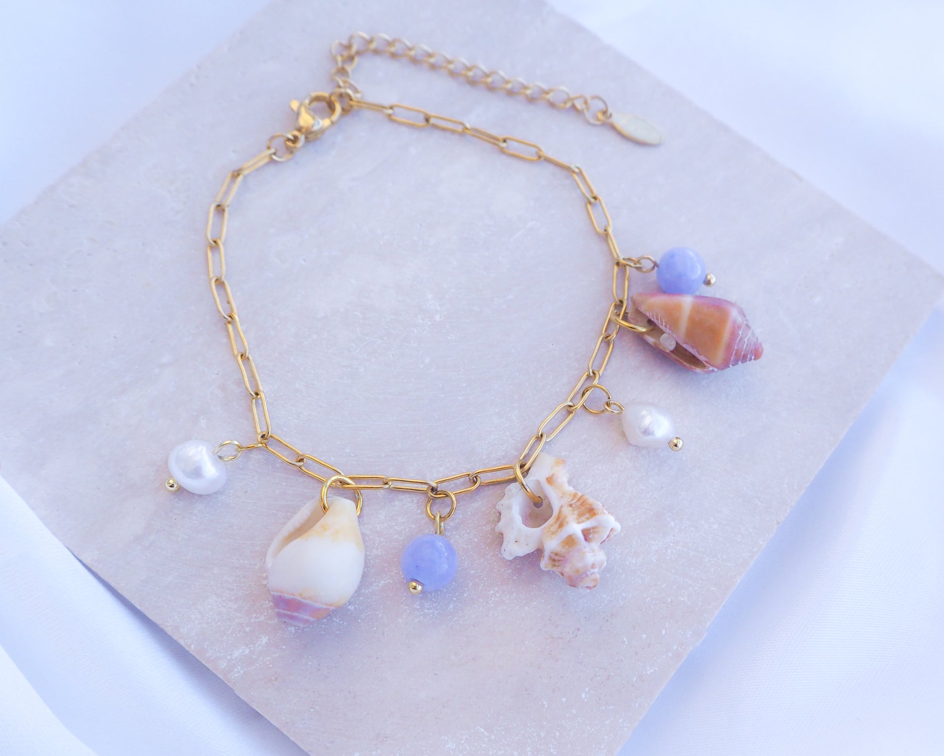 Real Shell Charm Bracelet with Pearls and Angelite Gemstones on stone, Shells from Portugal 