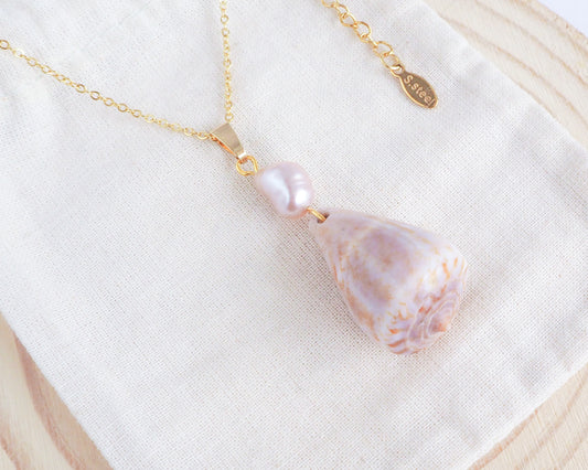 Rose Pearl Cone Shell Necklace on display