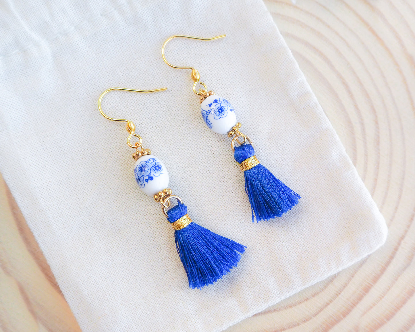 Royal Blue Portuguese Tile Gold Earrings on display