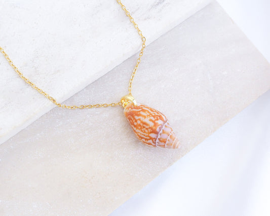 Rustic Dove Shell Gold Necklace on display, Detailed view of the Rustic Dove pendant, showcasing its natural patterns and coastal elegance. Sea By Lou