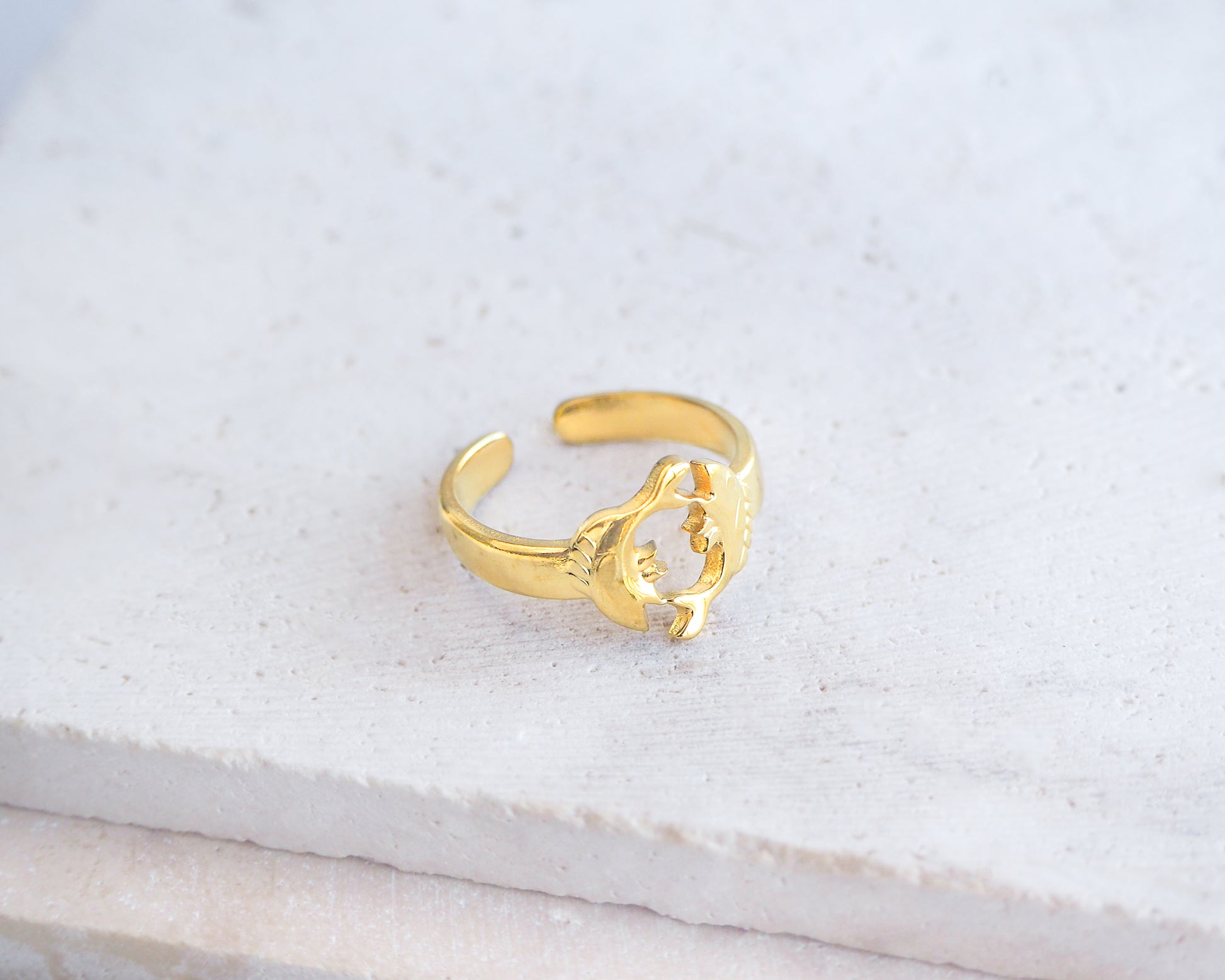 Side view of Gold Pisces Zodiac Ring on stone displayed, adjustable 18k gold stainless steel Fish ring 