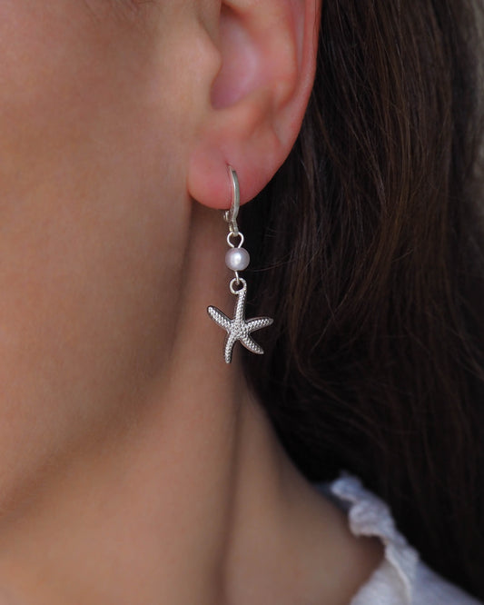 Model wearing 925 Silver Earrings with Pearl Beads and Silver Sea Star - Beach-Inspired Elegance
