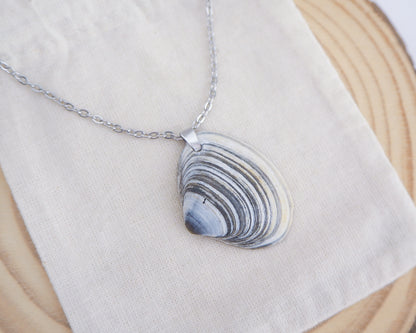 Close up of Blue White Striped Atlantic Surfclam Shell Silver Necklace from Portugal on display