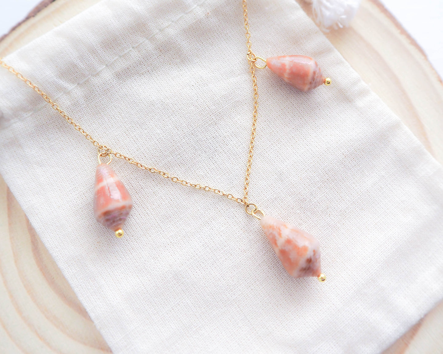 The Gold Stainless Steel Necklace elegantly displayed, showcasing its coastal charm and timeless elegance of the Mediterranean Cone Shell, Seabylou