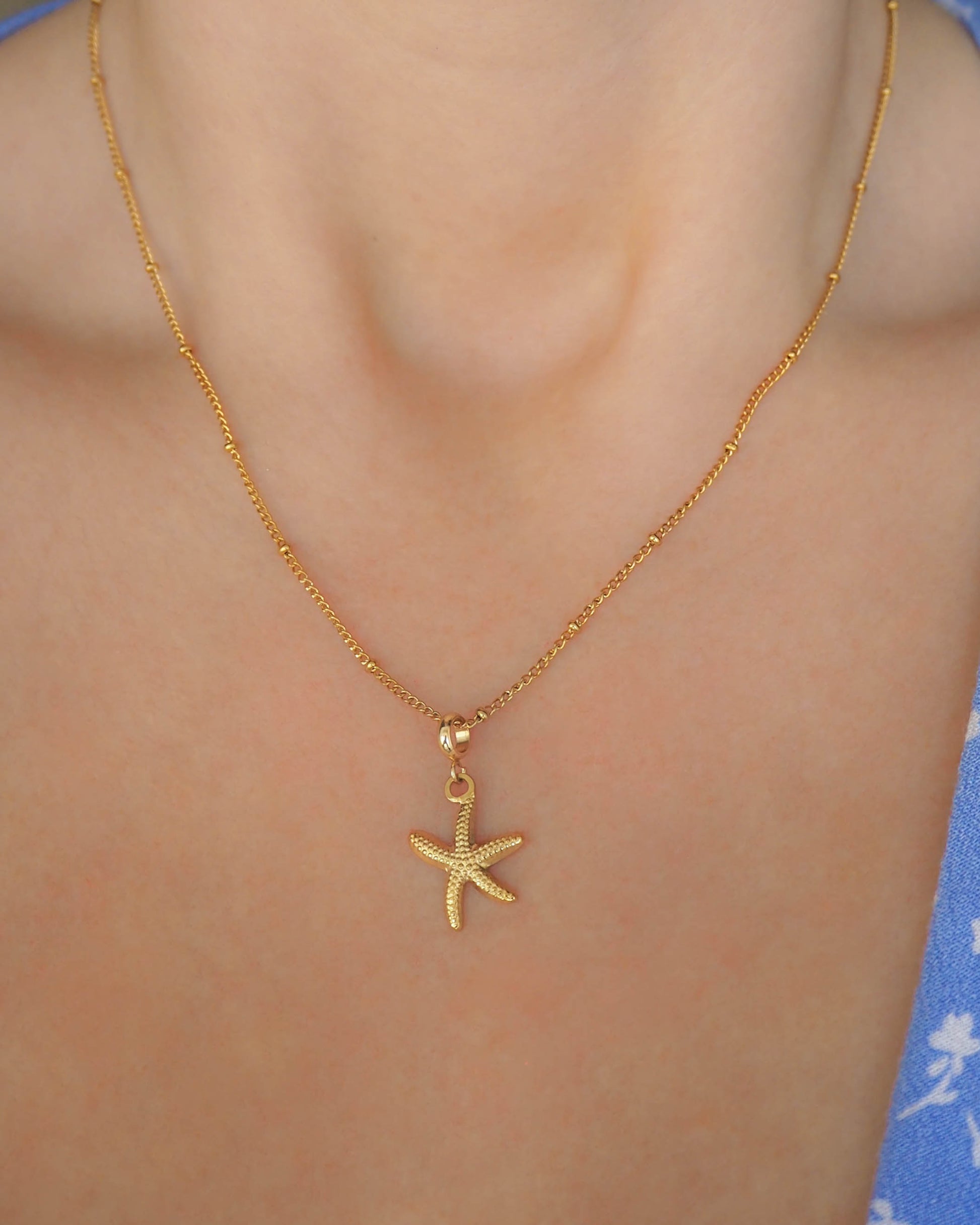 Model wearing Sea Star Gold Necklace – Stainless Steel Coastal Jewelry, Hypoallergenic Elegance for Beach Girls, Sea by Lou, Cuba dots necklace chain, Starfish pendant, Seabylou