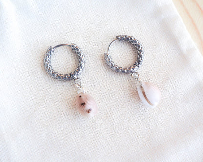 Close-up of European Cowrie Jewelry: Unique Silver Stainless Steel Earrings, Handcrafted from Portugal