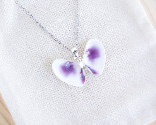 Purple Coquina Shell Butterfly Silver Necklace on display