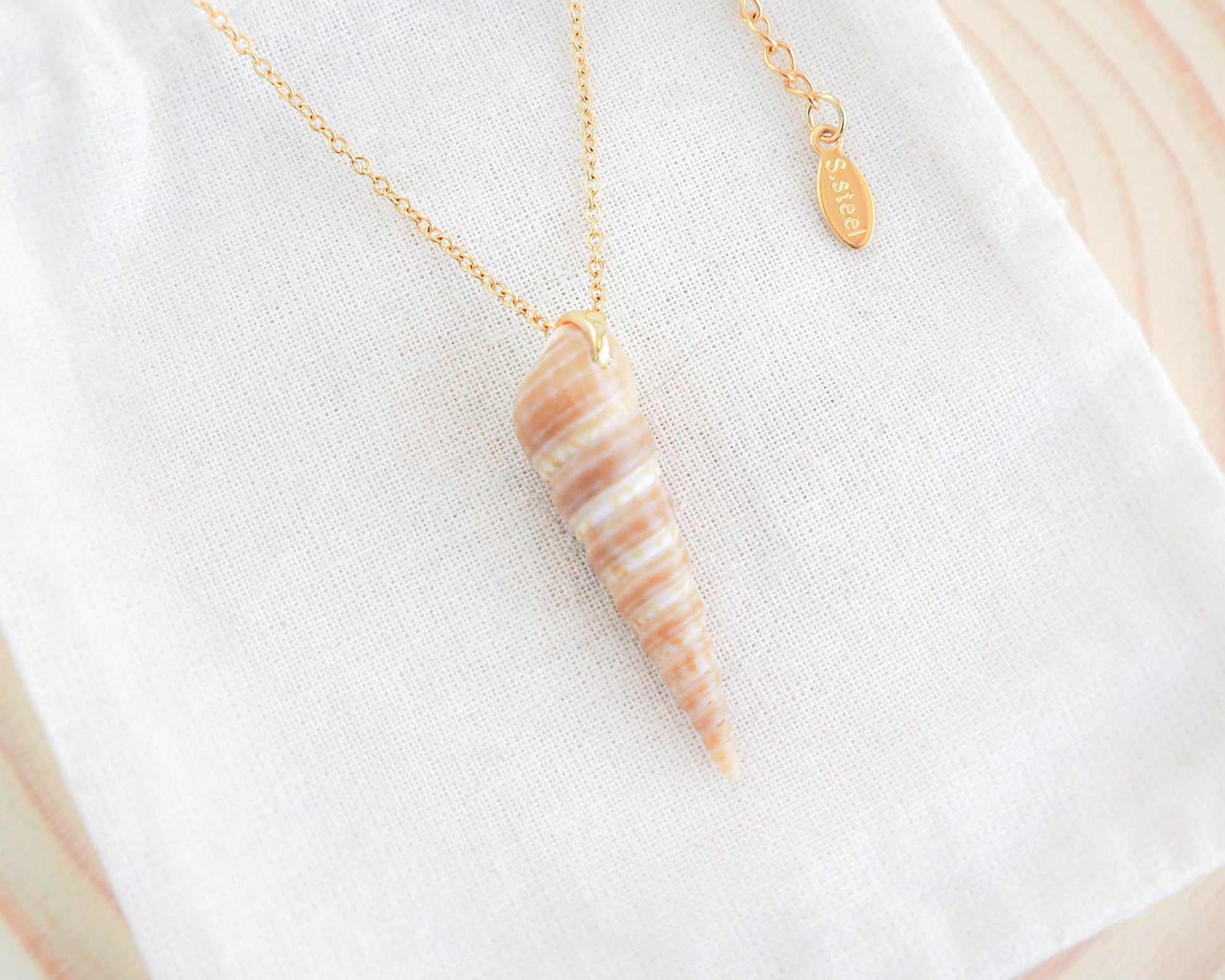 Gold Common Tower Shell Necklace on display, Real Shell from Portugal
