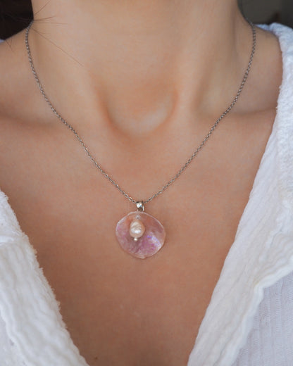 Silver Necklace with Pink Jingle Shell freshwater pearl, Mother of Pearl Pendant on model