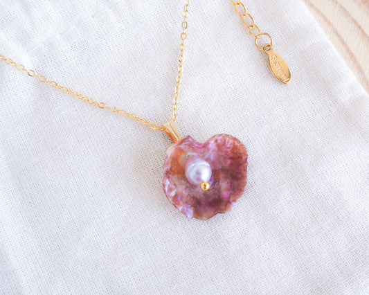 Fuchsia Pink Jingle Mother of Pearl Shell Necklace with Gold Chain on display