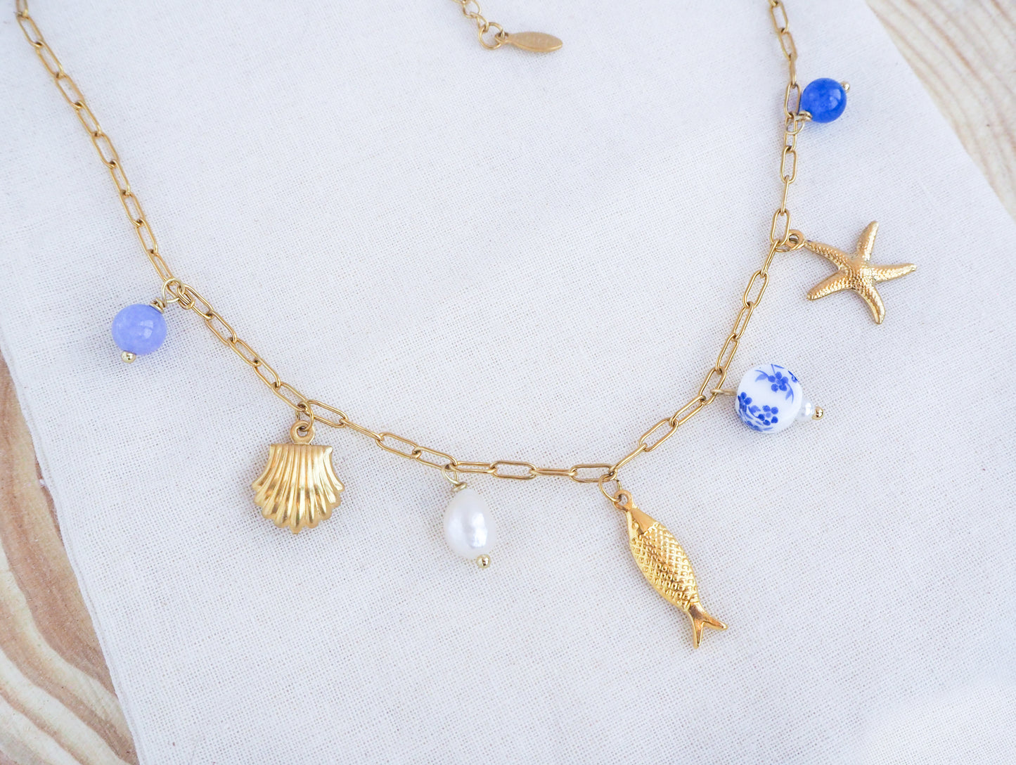 Portuguese Sardine Azulejo Gold Necklace on display