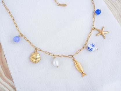 Portuguese Sardine Azulejo Gold Necklace on display