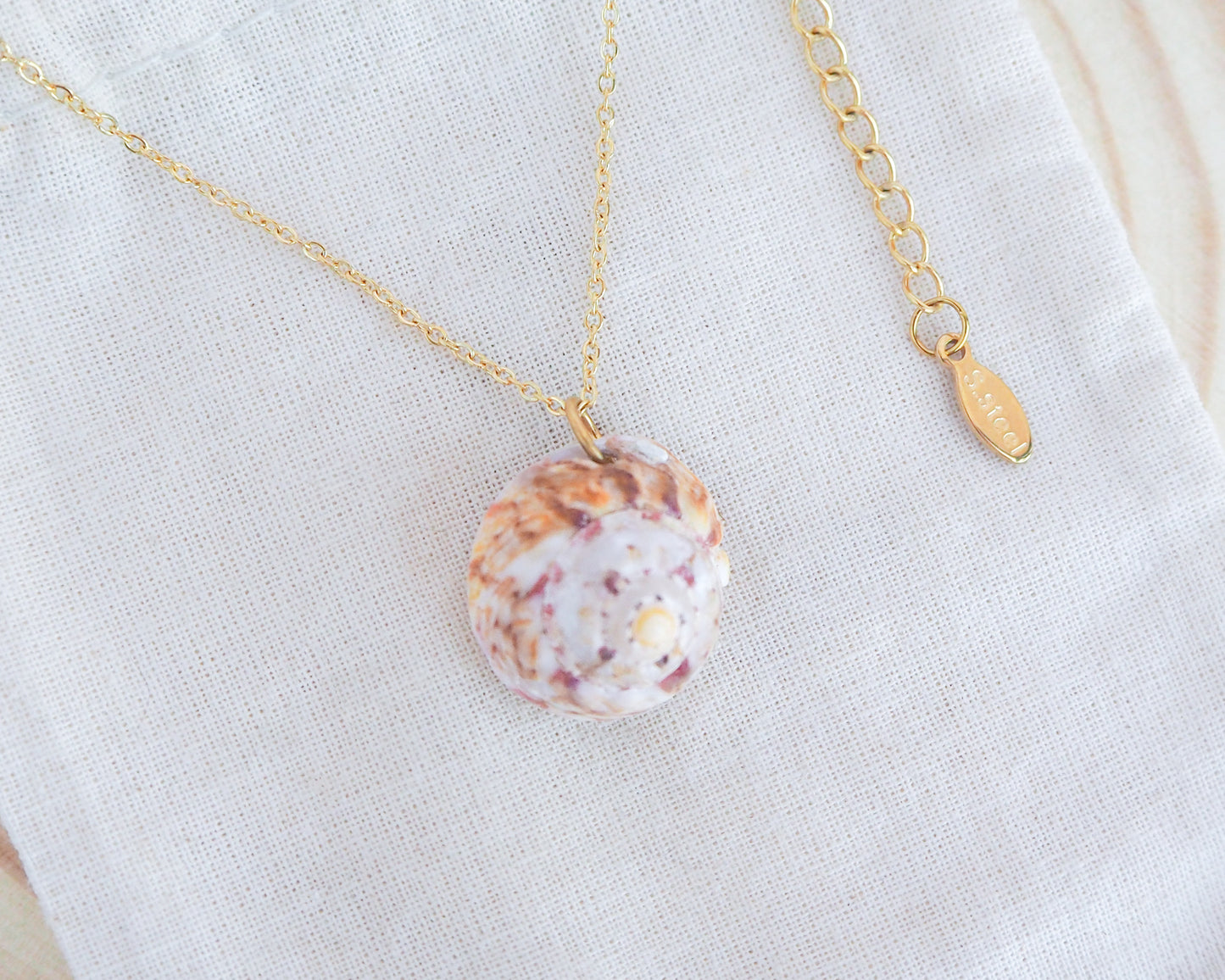 Side view of Sunny Magus Top Shell Necklace from Portugal on display 