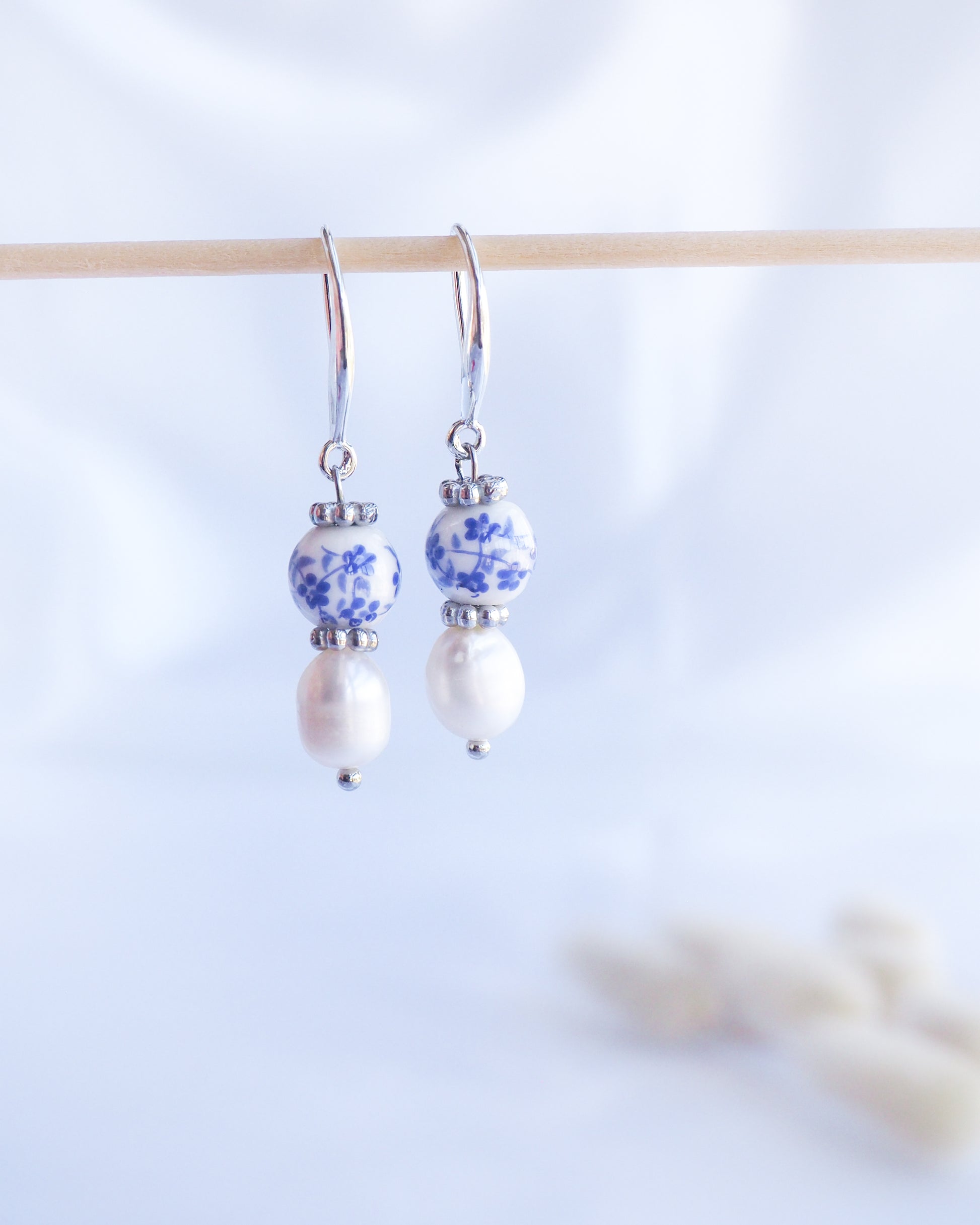 Pair of earrings with floral and pearl design on a light background. Azulejo Silver Earrings from Portugal, Portuguese Tlles, Blue White Flower Porcelain Earrings