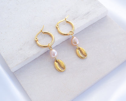 Gold Hoop Earrings with Cowrie Shells and Pearls on stone. Made with premium 14k and 18k gold stainless steel and pink freshwater pearl beads. 