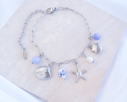Close up of Silver Oceanic Charm Bracelet with Azulejo Tile Beads, Gemstones, Starfish, Sea Star and Shell pendants