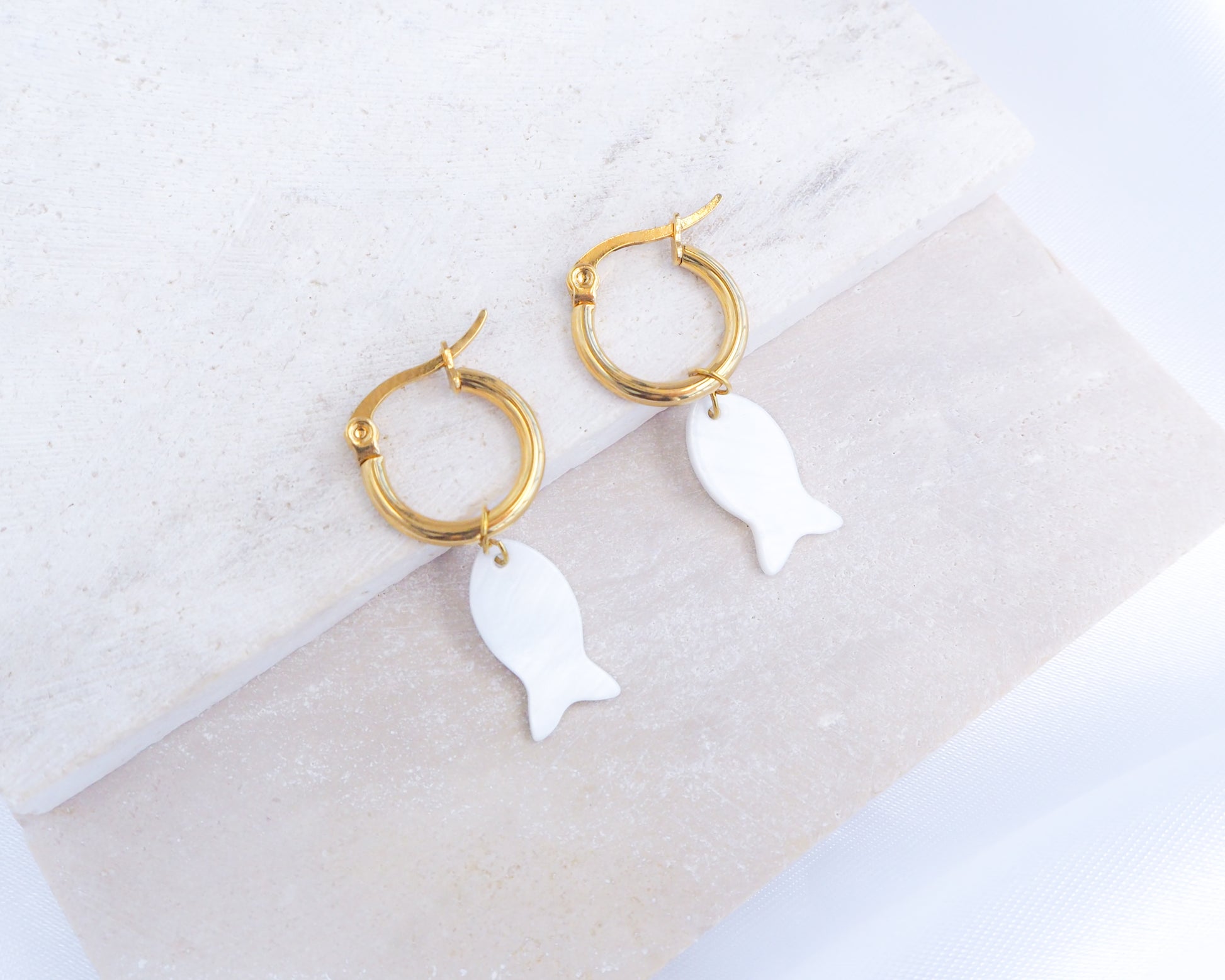 Gold Mother of Pearl Fish Earrings in ear, gold fish shell earrings from Portugal, Starfish Earrings, Sea Star, Coin Sun Earrings