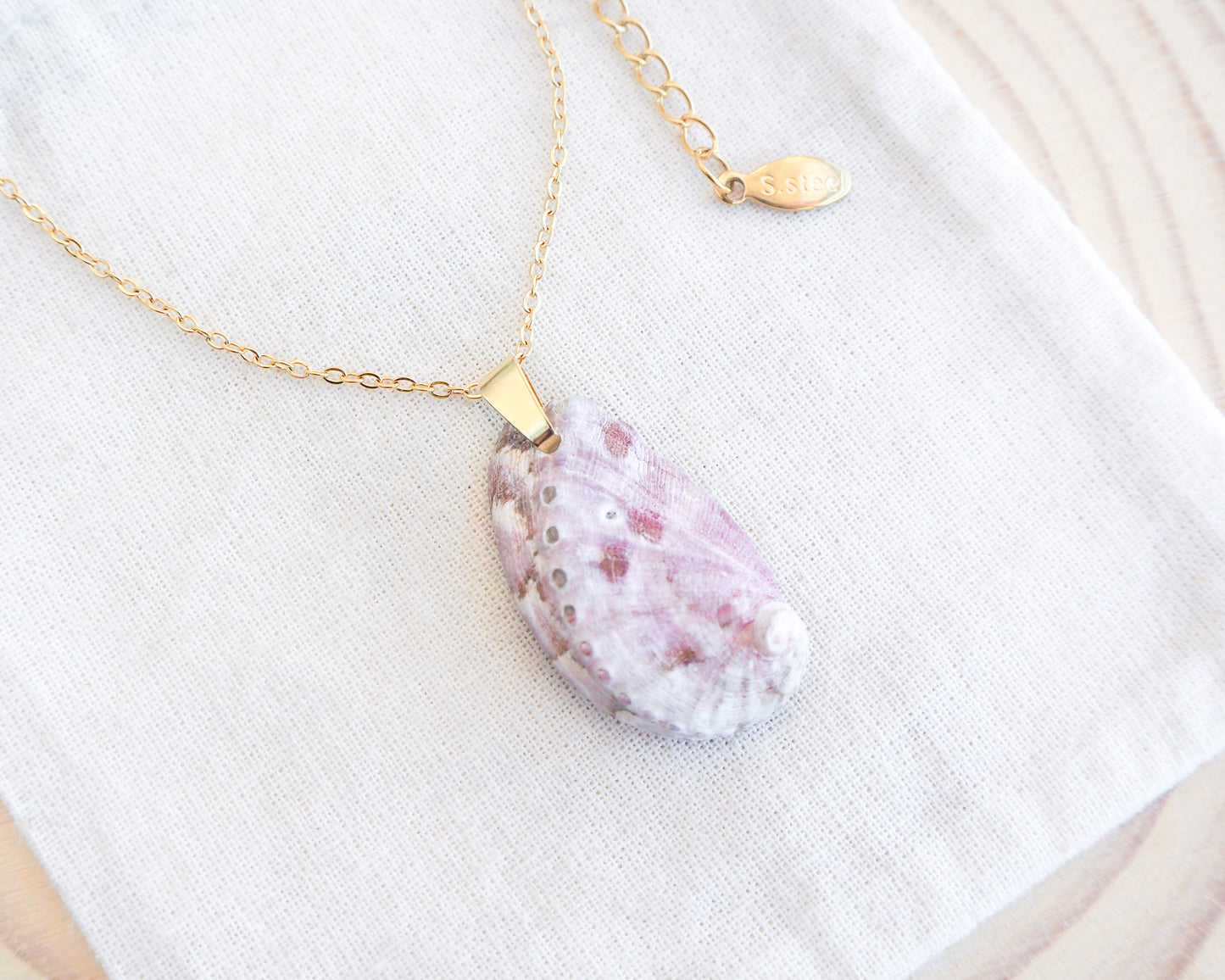 Soft Lilac Abalone Shell Gold Necklace on display