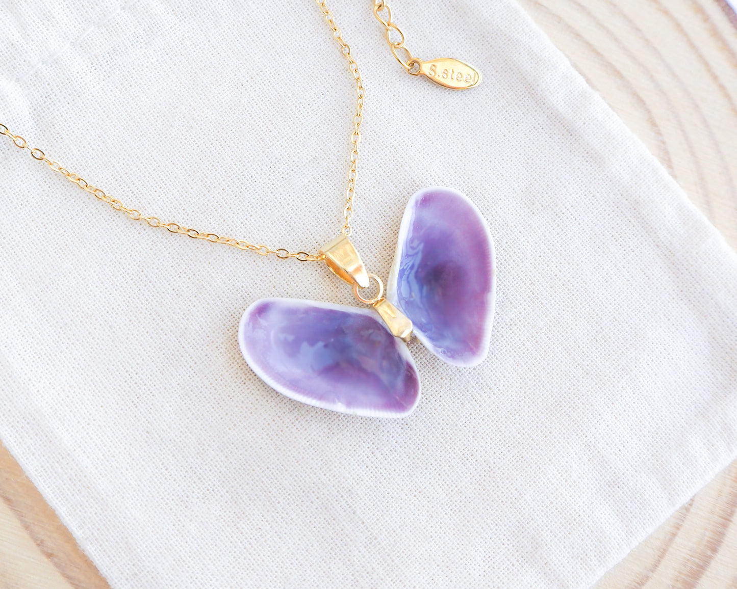 Purple Coquina Shells Butterfly Gold Necklace on display, Purple Shells from Portugal