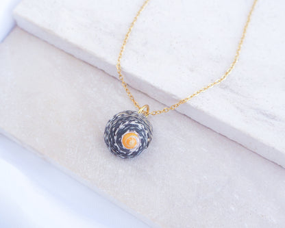 Shell pendant necklace on a white background. Gold Lined Top Shell Necklace, Shell from Portugal side view
