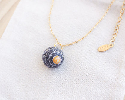 Gold Lined Top Shell Necklace on display, Shell from Portugal side view