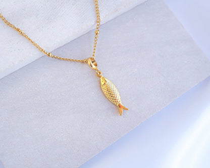 Sardine Fish Gold Necklace from Portugal on stone 
