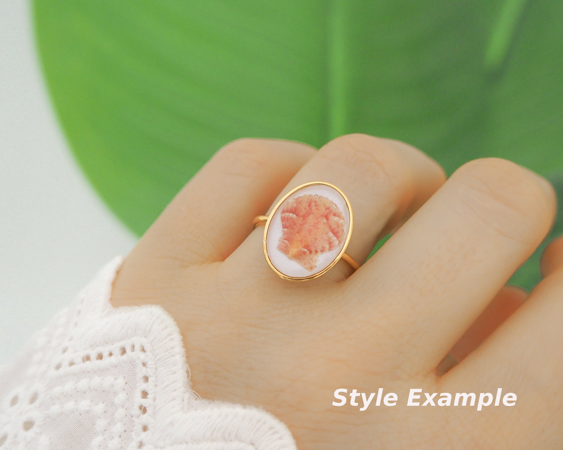 Model wearing Tiny Scallop Shell Gold Ring on finger. Tiny Orange Pink Scallop Shell Bezel Ring, 18k gold stainless steel, handpicked scallop shell from the beach of Portugal, 