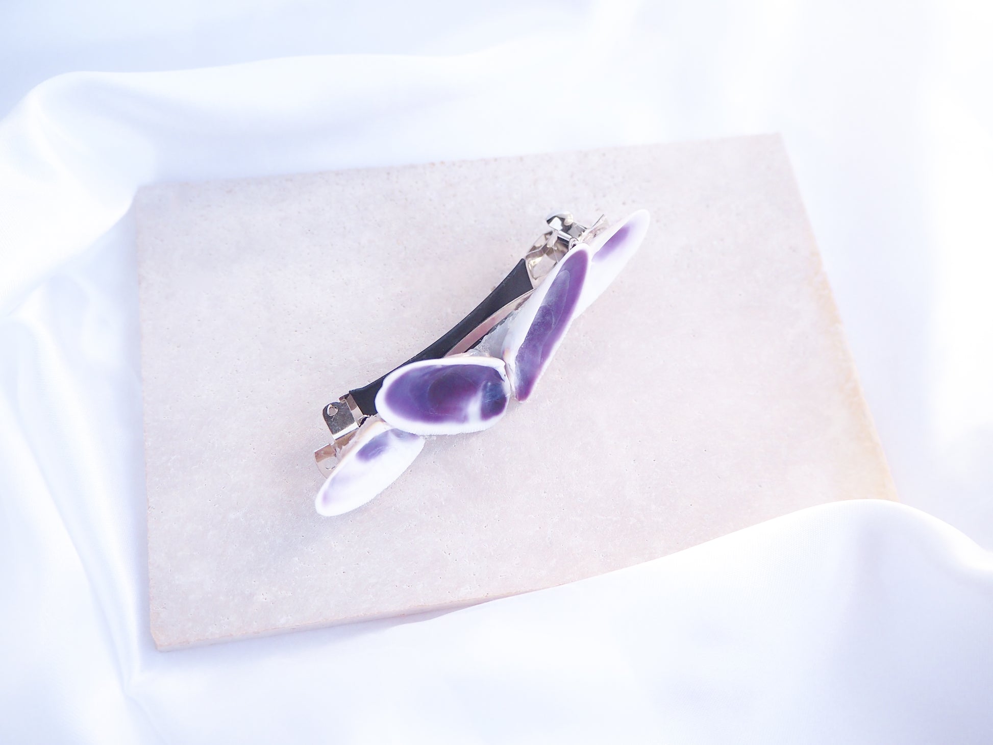 Front view of Purple Coquina Shells Butterfly Hair Clip Barrette on stone displayed, Purple Shells from Portugal, Handpicked Real Coquina Shells, Sea Butterfly Shell Hair Decoration, Seashell Wedding Hair Assocciares, Coastal Christmas gift, Beach Wedding Hair