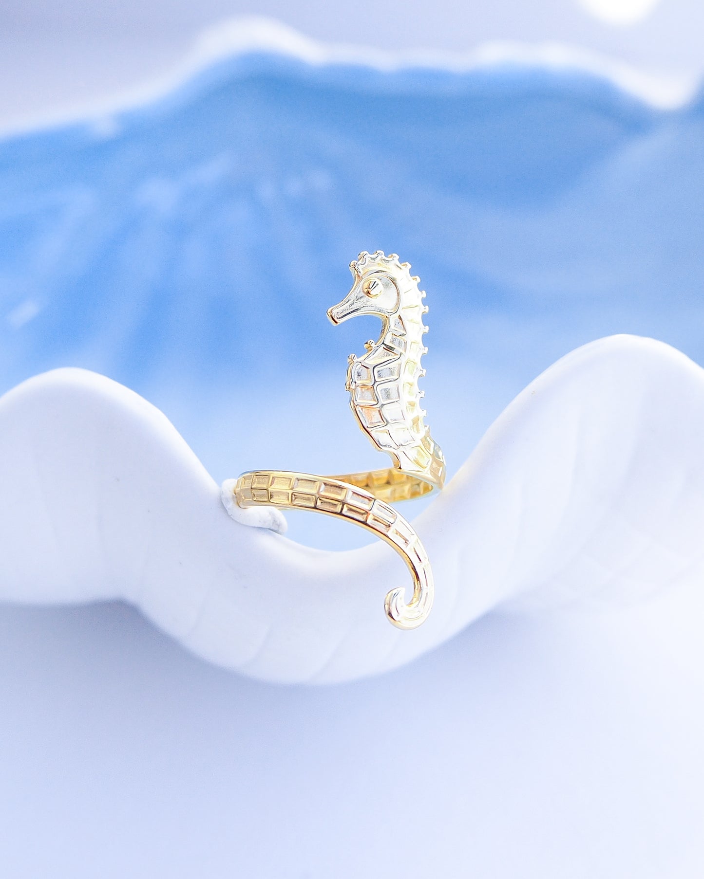 Close up of Gold seahorse ring on blue background, hippocampus ring 14k gold stainless steel