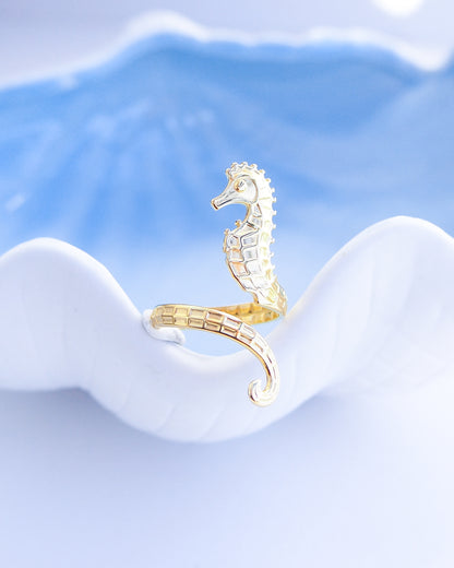 Close up of Gold seahorse ring on blue background, hippocampus ring 14k gold stainless steel