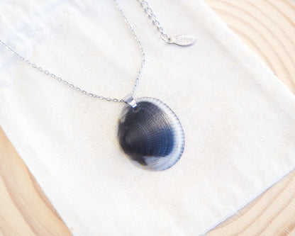 Close up of Black White Shell Necklace cotton displayed, Real Dark Bittersweet Clam Shell from Algarve, Portugal, Silver Stainless Steel chain