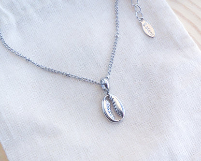 Silver Cowrie Necklace on display