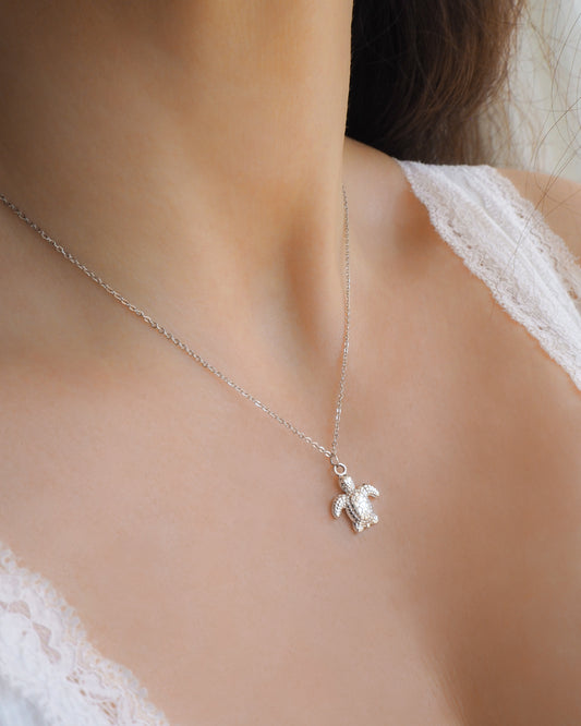 Model wearing Turtle Necklace with normal silver stainless steel chain 