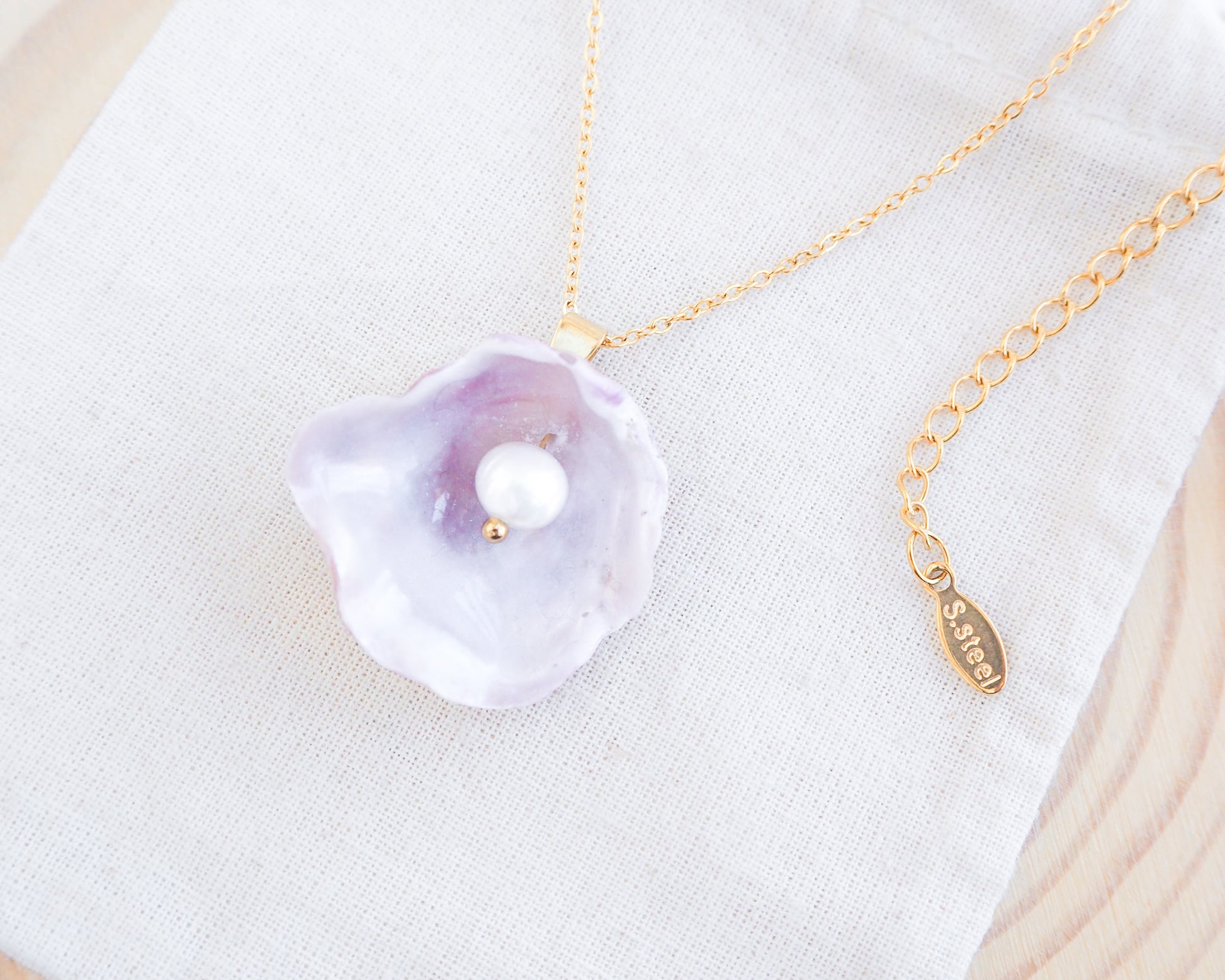 Soft Pink Pearly Shell Necklace, Gold Jingle Shell Necklace on display, Sea by Lou, Mother of Pearl Shell Portugal 