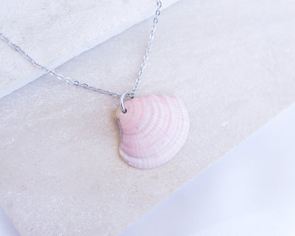 Soft Pink White Striped Venus Shell Silver Necklace from Portugal displayed on stone, Handpicked seashell from Algarve Portugal with silver necklace chain, perfect gift for beach girls, holiday memory portugal