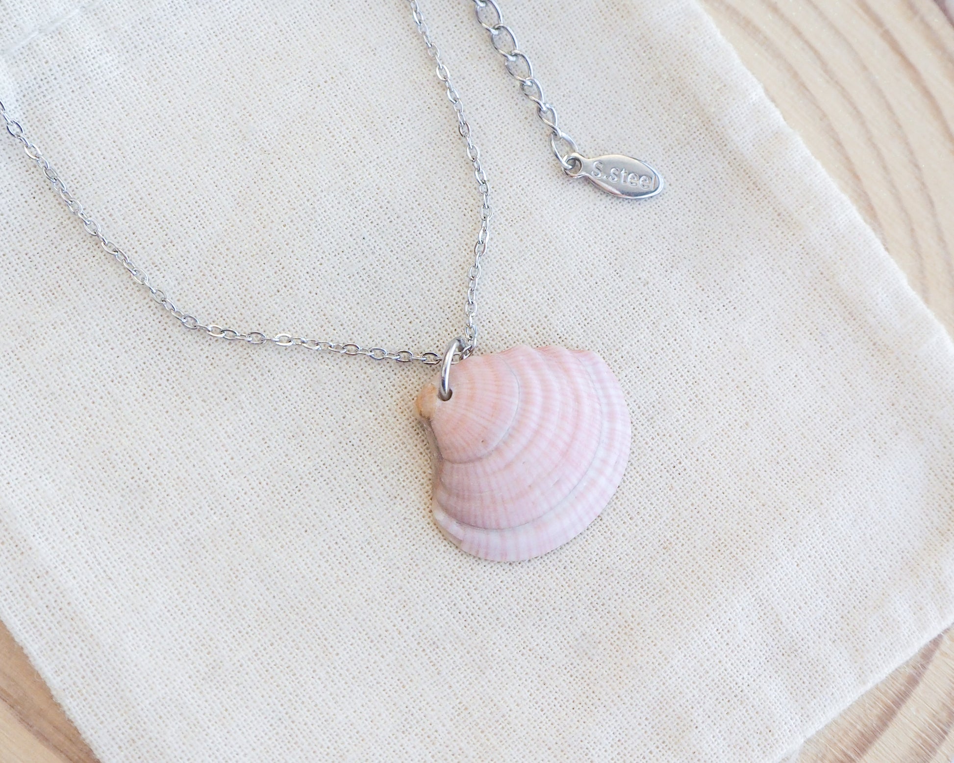 Soft Pink White Striped Venus Shell Silver Necklace from Portugal on display, Handpicked seashell from Algarve Portugal with silver necklace chain, perfect gift for beach girls, holiday memory portugal