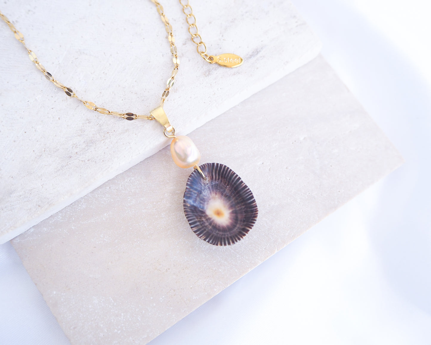 Striped Limpet Shell Pearl Necklace on display, Dark Limpet Shell from Portugal with freshwater pearl and gold chain. 