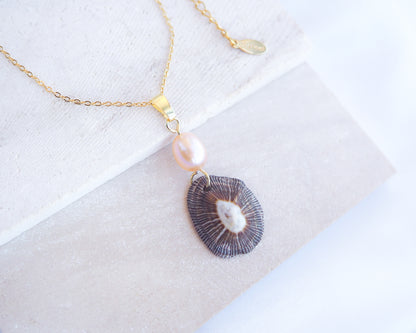 Front view of Striped Limpet Shell Rose Pearl Necklace on display, Dark Limpet Shell from Portugal with freshwater pearl and gold chain. 