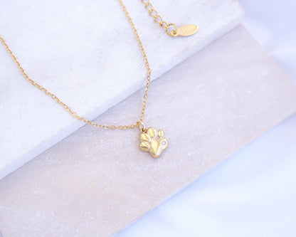 Tiny Cat Paw Gold Necklace on stone displayed, Memory Cat Jewelry, Gold Cat Necklace 