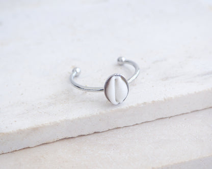 Side view of European Cowrie Shell Silver Ring from Portugal on stone display, Handpicked Spotted Cowrie Shell from Portugal, Silver Stainless Steel ring with tiny cowrie shell, Gift for beach girls