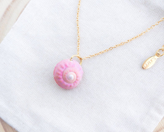Tiny Pink Shell Gold Necklace, Pink Magus Top Shell from Portugal on display 