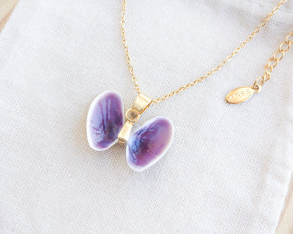 Tiny Purple Butterfly Shell Gold Necklace side view on display, Coquina Shells from Portugal