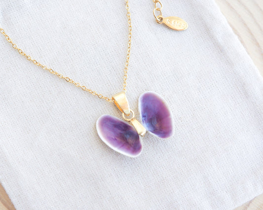 Tiny Purple Butterfly Shell Gold Necklace on display, Coquina Shells from Portugal