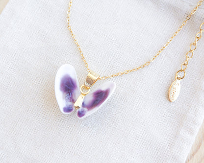 Tiny Purple White Coquina Butterfly Shells Gold Necklace on display side view 
