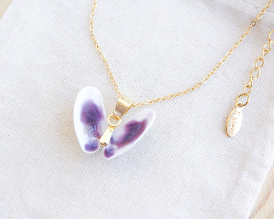 Tiny Purple White Coquina Butterfly Shells Gold Necklace on display side view 