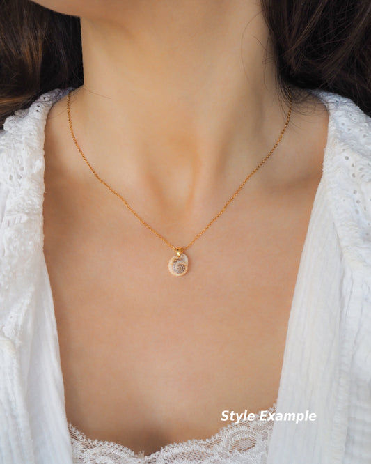 Model wearing Gold Tritia Neritea Shell Necklace, handpicked tritia neritea shell from Portugal, 18k gold stainless steel necklace chain 