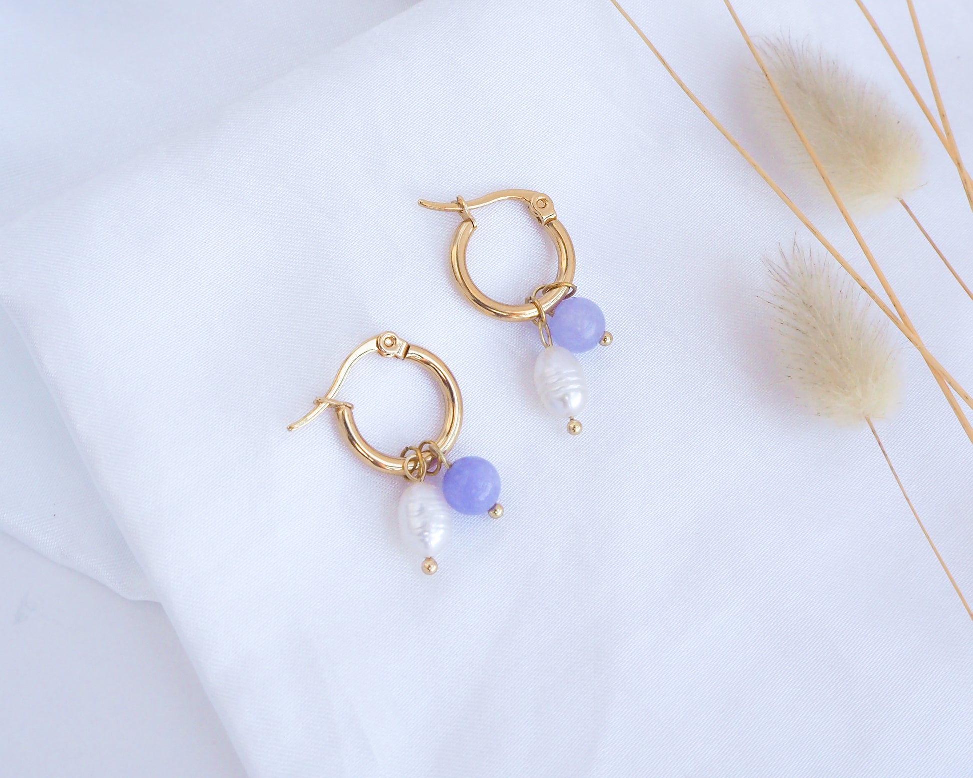 Wedding Earrings Gold Freshwater Pearl Earrings with Gemstones on display