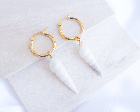White Common Tower Shell Gold Earring Hoops displayed on stone, handpicked white tower shells from Portugal, 18k gold stainless steel shell earring hoops, seabylou 